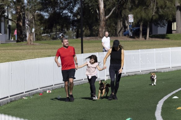 A family take a stroll AT Gore Hill Oval in St.Leonards, during lockdown.