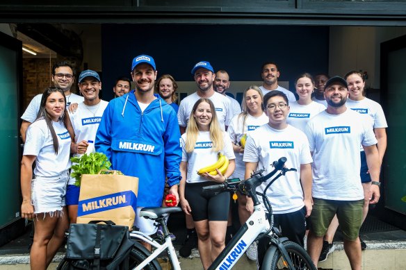 Milkrun founder Dany Milham (in blue jacket) with staff.