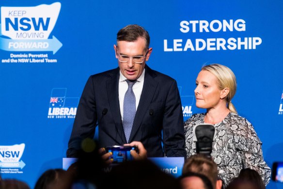 Premier Dominic Perrottet, with wife Helen, concedes defeat at the Liberal Party’s election event at the Hilton Hotel in Sydney.
