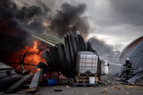 Firefighters work on a chemical warehouse that was hit by Russian shelling on the eastern frontline near Kalynivka village, in Kyiv, Ukraine, On March 8.