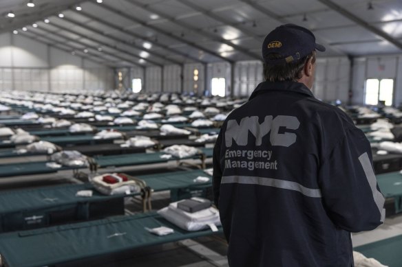 An NYC Emergency Management official during a tour of a new migrant holding centre on Randall’s Island in New York.