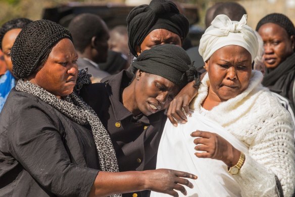 Akon Guode at her children's funeral in April 2015.
