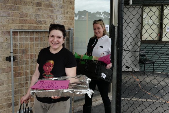 Volunteers bring food and water to people in Maribyrnong on Sunday.