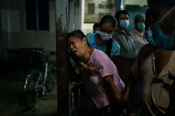 The mother of a protester mourns at a hospital after her son was killed during clashes in Yangon, Myanmar. 
