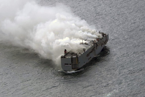 Smoke is seen from a freighter ship the Fremantle Highway. 