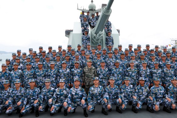Chinese President Xi Jinping, center in green military uniform, poses with soldiers on a navy ship after he reviewed his navy fleet in the South China Sea in 2018 China has conducted several live-fire military exercises in the Taiwan Strait amid heightened tensions over increased American support for Taiwan. 
