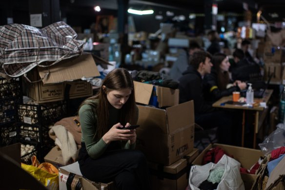 A volunteer takes a break in the Science Centre in Ternopil, Ukraine, where supplies are gathered and sent to internally displaced persons, and residents of attacked towns.