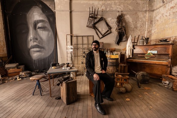 Artist Rone in his architectural intervention upstairs at Flinders Street Station.