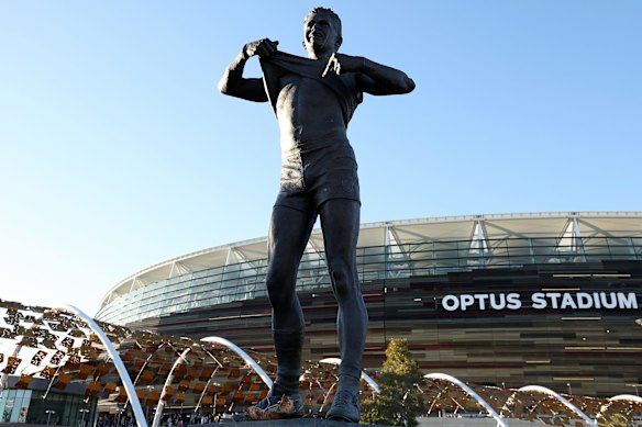 The statue of Nicky Winmar’s famous stance against racism stands outside Perth’s Optus Stadium.