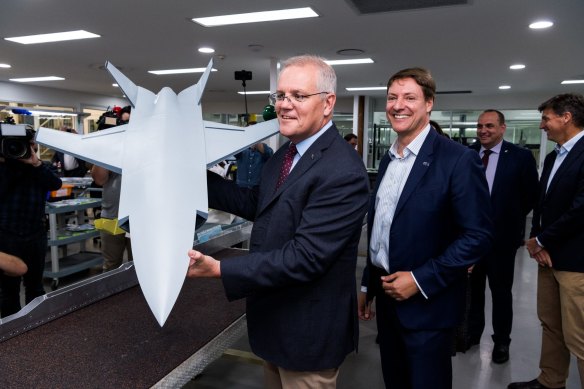 Australian Prime Minister Scott Morrison holding a model of the Ghost Bat Drone. 