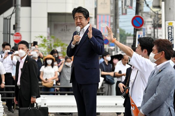 Former Prime Minister Shinzo Abe makes a street speech before being shot in front of a train station in Nara. 