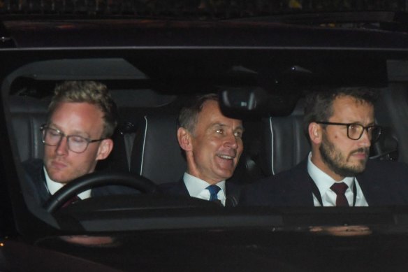 Jeremy Hunt, UK chancellor of the exchequer, centre, departs 10 Downing Street in London.