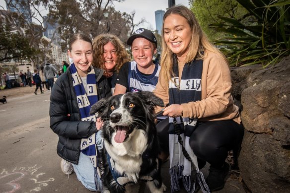 Cats fans Isabel Harbison, Suzanne Harbison, Max Harbison and Leanne Durante with Dolly at the parade on Friday. 