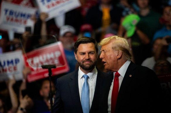 Donald Trump with J.D. Vance at Saturday’s (Sunday AEST) campaign rally at Grand Rapids, Michigan.