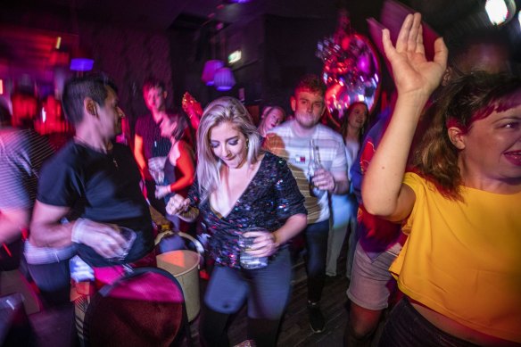 Club-goers, like these at The NightCat in Fitzroy,  celebrated in December last year as dancefloors reopened after Melbourne’s long second lockdown.