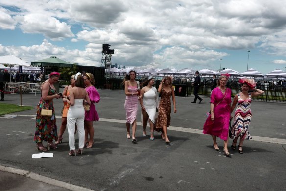 Racegoers attend Stakes Day at Flemington.