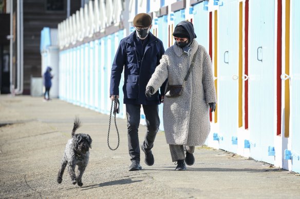 Wellington residents take their dog for a walk during a level-four lockdown  on Thursday.