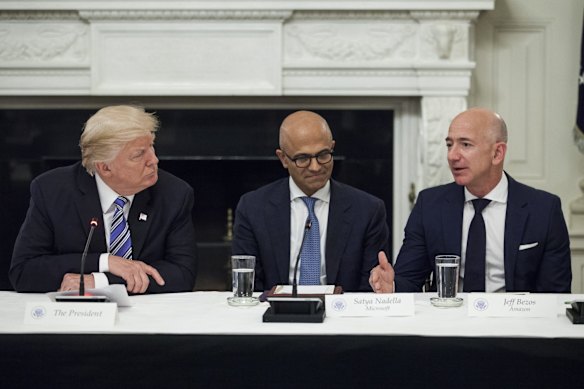 Donald Trump with Microsoft chief Satya Nadella and Amazon founder Jeff Bezos.