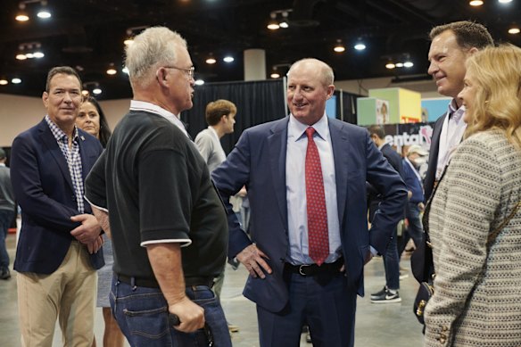 Greg Abel (centre), chairman of Berkshire Hathaway Energy, during a shareholders’ shopping day.