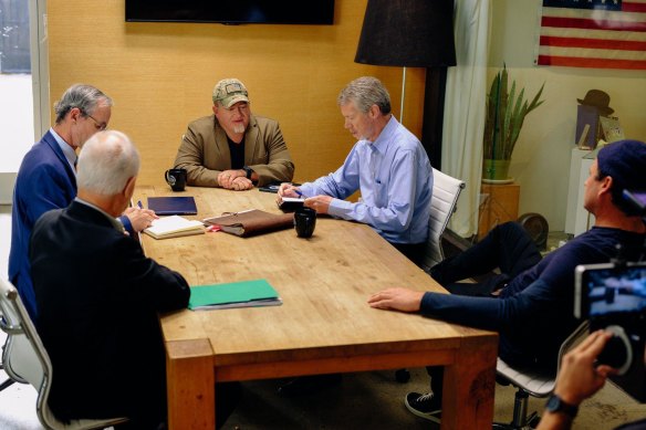 Former defence department official Luis Elizondo, centre, meets with former CIA official Jim Semivan, far left, former US intelligence official Christopher Mellon, second from left, aviation expert Steve Justice, right, and musician Tom DeLonge, far right.