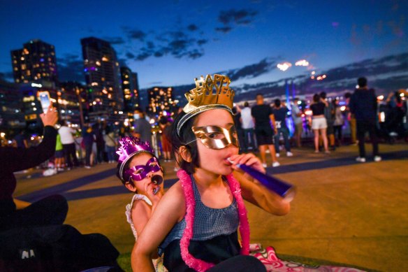 Youngsters Eva (left) and Naomi Cranenburgh watch the family-friendly fireworks on New Year’s Eve last year.