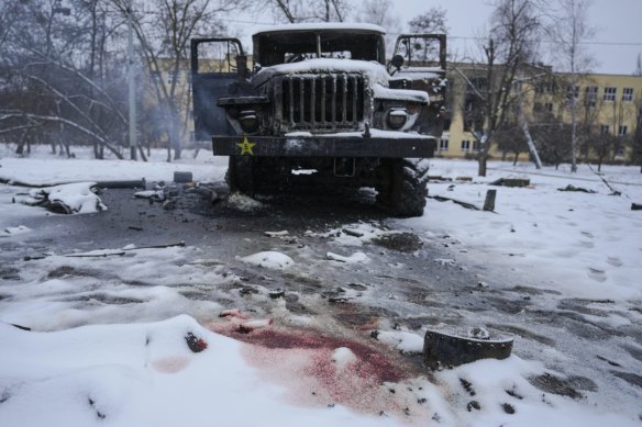 Blood colours the snow next to a destroyed Russian rocket launcher vehicle on the outskirts of Kharkiv, Ukraine on Friday.