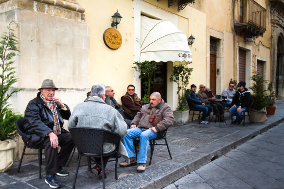 Older men gather in bars, on park benches and in the piazzas each morning.