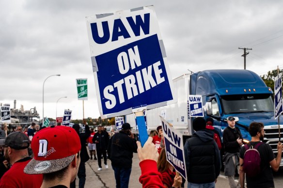 United Auto Workers members and supporters attempt to block a truck from entering the Ford assembly plant in the US state of Michigan in September.