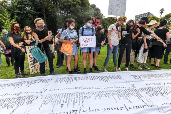 Rally-goers unfurled a list of almost 900 women and children killed by male violence in Australia since 2008 in Melbourne.