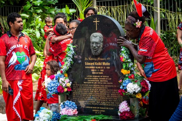 Family members pay their respects at Mabo's grave.