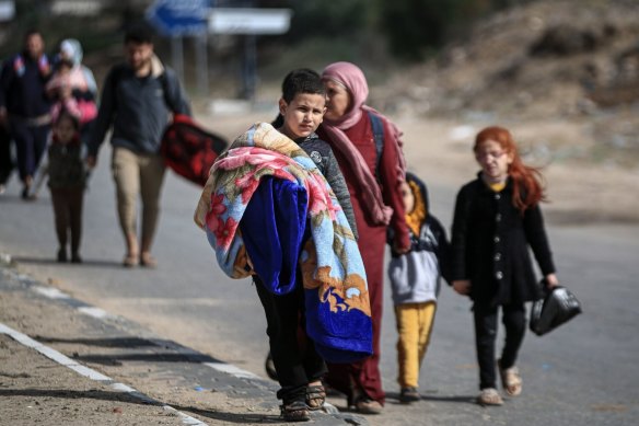 Displaced Palestinians walk along the Salah al-Din road towards the southern Gaza Strip in November. The UN estimates more than 80 per cent of the Gazan population of 2.3 million is displaced.