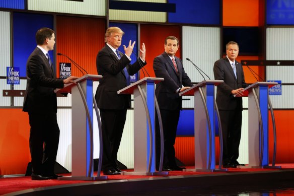 Republican presidential candidate Donald Trump, second from left, shows his hands during a Republican debate in 2016 while Marco Rubio (left), Ted Cruz and John Kasich look on. 