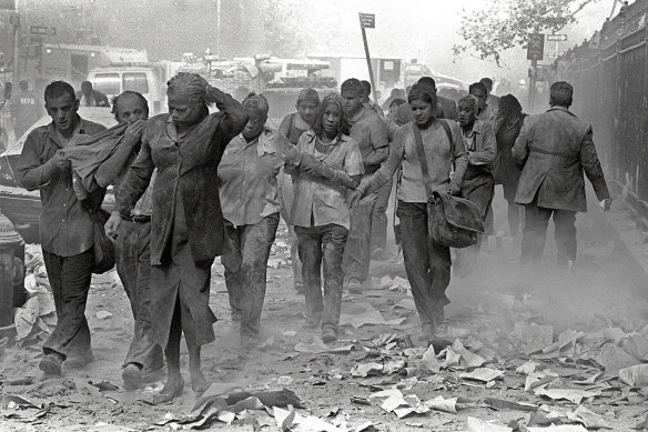 People make their way from the World Trade Centre in New York on Tuesday, September 11, 2001.  