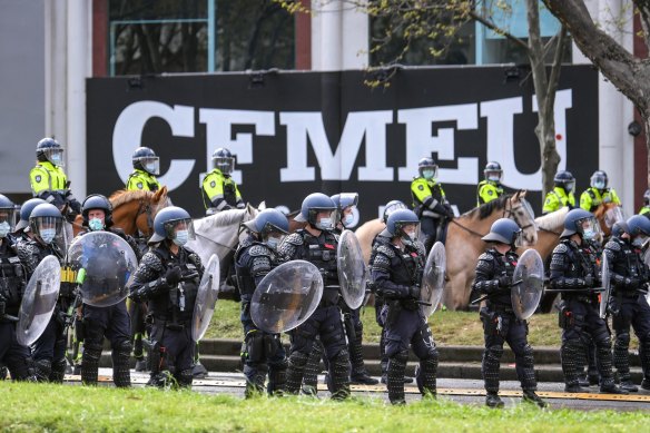 Police were forced to guard the CFMEU office in Melbourne after the protests. They are also among the next groups who will have vaccination mandated.