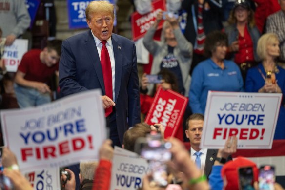 Former US president Donald Trump, greets attendees during a “Get Out The Vote” rally at Winthrop Coliseum in Rock Hill, South Carolina.
