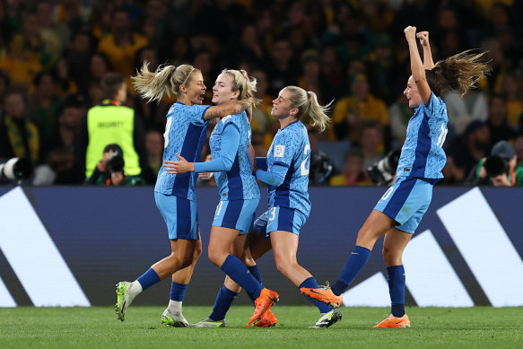 Lauren Hemp celebrates with her England teammates during the  Women’s World Cup semi-final against Australia.
