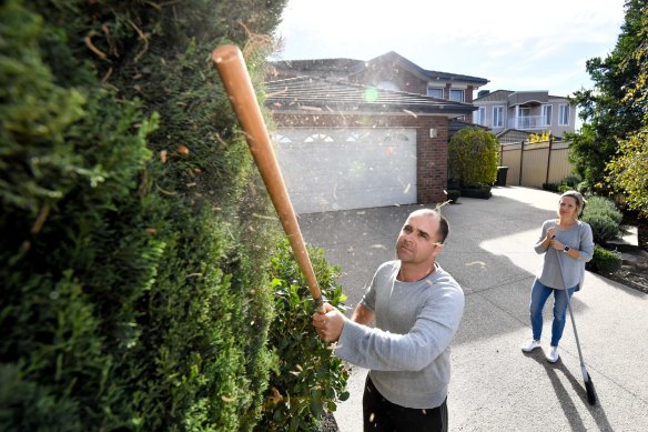 Anna and Mike Jez inspect dust from  the Kealba landfill settling around their home in May 2021.