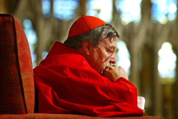 Cardinal George Pell in contemplation during a Sydney mass in 2004.