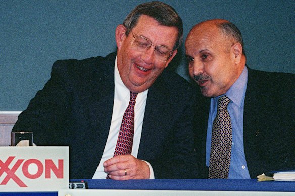 Exxon’s Lee Raymond and Mobil Corp Chairman and CEO Lucio Noto before they announced the merger of the two oil giants in 1998.