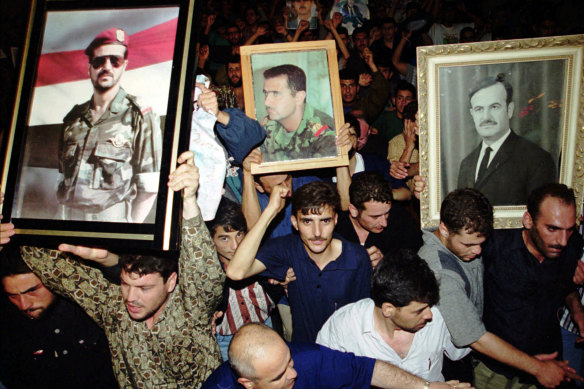 After then president Hafez al-Assad died in 2000, mourners carried posters of him and his two sons: Basil (left), who died in a car crash in 1994, and Bashar (centre), who succeeded him.