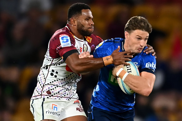 Beauden Barrett of the Blues is tackled during the round 13 match.