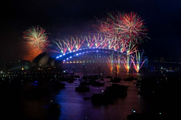 Fireworks light up the sky above Sydney Harbour at midnight on New Year’s Eve. 