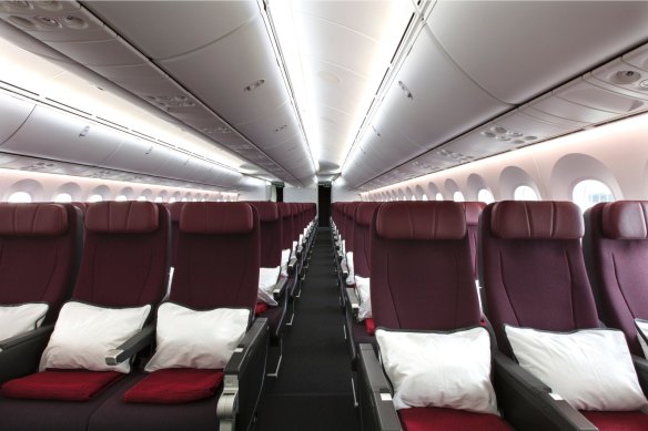 The rear of the economy cabin has no overhead luggage compartments above the middle seats.