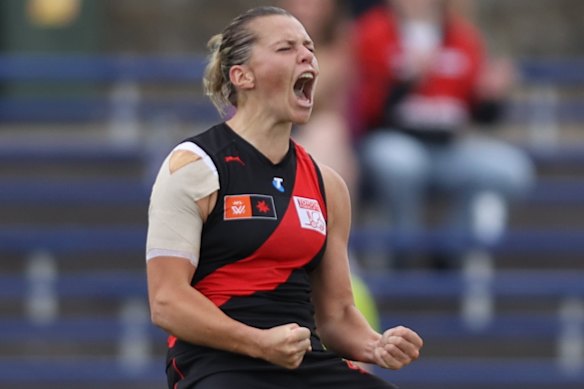 Maddison Gay of the Bombers celebrates kicking a goal.