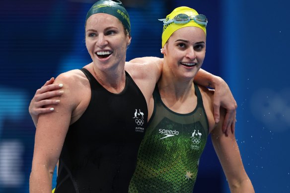 Bronze medalist Emily Seebohm and gold medalist Kaylee McKeown celebrate after the 200-metre backstroke final. 
