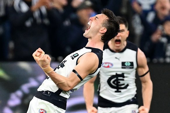 Jagga Smith of the Blues celebrates kicking a goal. The Cats could tag him.