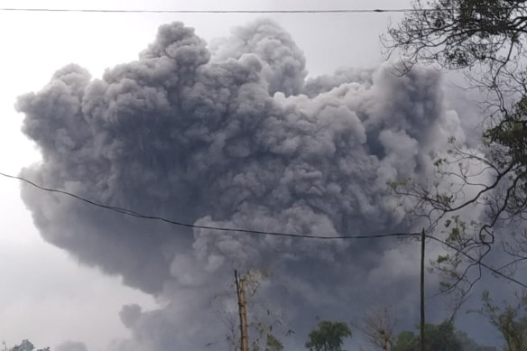 In this photo released by Indonesia's National Disaster Mitigation Agency (BNPB) Mount Semeru spews volcanic material during an eruption in Lumajang, East Java, Indonesia, Saturday, January 16.