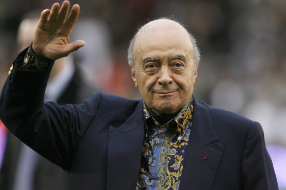 Mohamed Al Fayed waves to the crowd before an English Premier League soccer match in 2008.