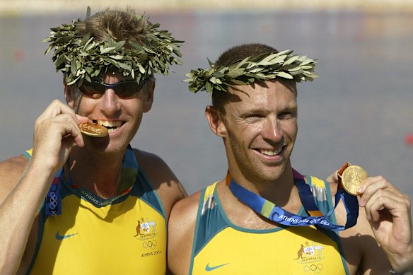 “Agitator” Drew Ginn (right) with the gold medal he won at the Athens 2004 Olympic Games.