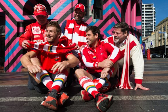 Swans players Kieren Jack and Nick Smith, with some of the Rainbow Swans in 2016. 